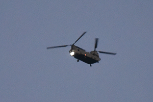 Dodgy animated gif of a helicopter with flashing lights passing in the evening sky