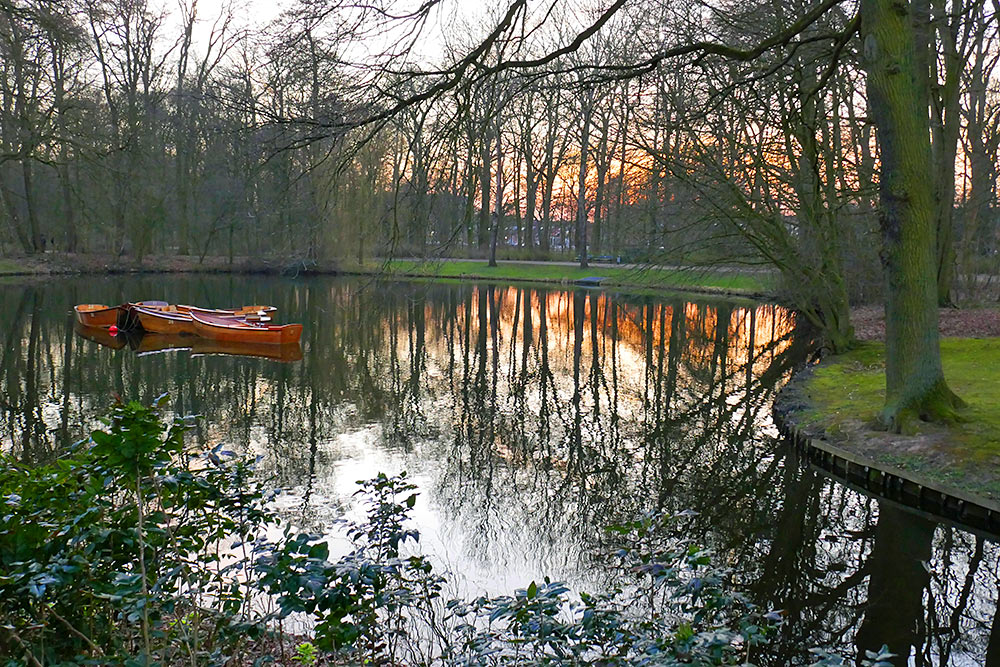 Picture of rowing boat moored in a small lake at sunset