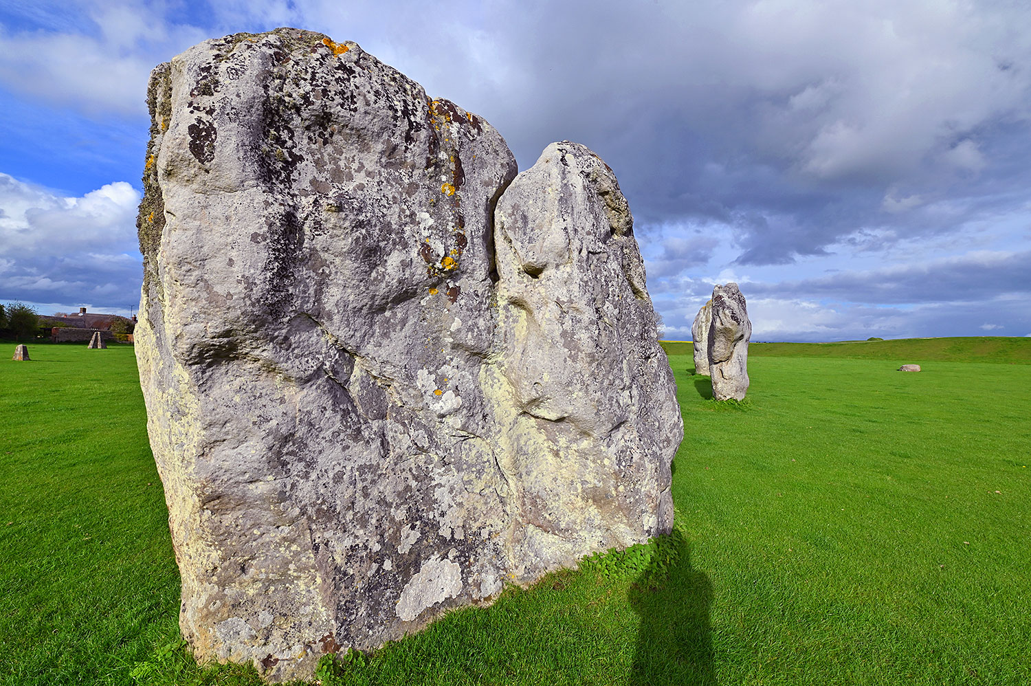 Picture of standing stones in a stone circle on a sunny May evening