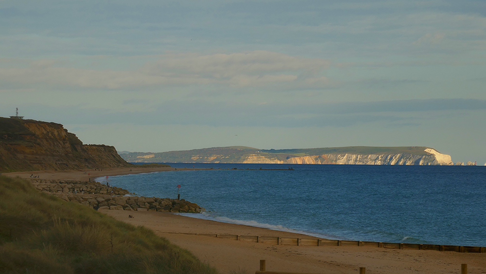Beach and cliffs at Hengistbury Head with the Isle of Wight in the background